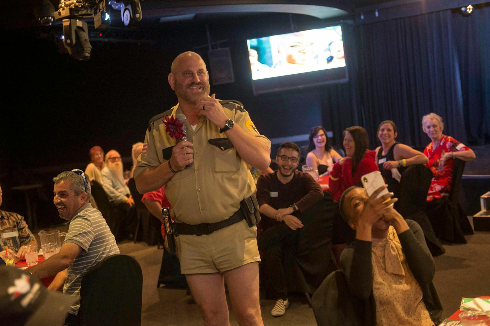 Interactive dinner show with performer in costume entertaining guests at Marriage Can Be Murder, Las Vegas.