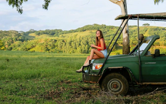 4x4 vehicle in Bel Ombre landscape during safari tour.