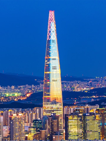 Lotte World Tower illuminated at night, view from Seoul Sky Observatory, South Korea.