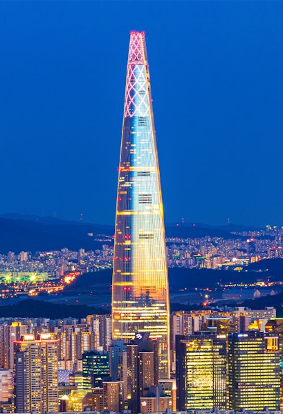 Lotte World Tower illuminated at night, view from Seoul Sky Observatory, South Korea.