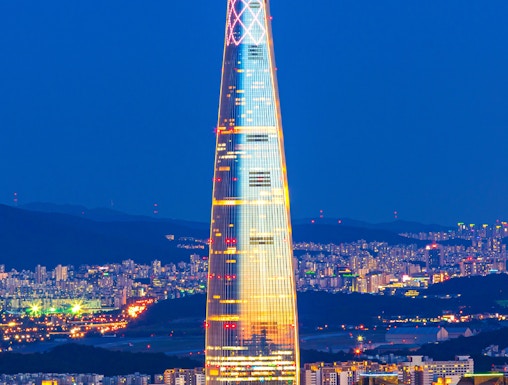 Lotte World Tower illuminated at night, view from Seoul Sky Observatory, South Korea.
