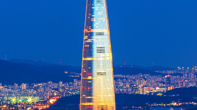 Lotte World Tower illuminated at night, view from Seoul Sky Observatory, South Korea.