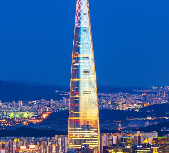 Lotte World Tower illuminated at night, view from Seoul Sky Observatory, South Korea.