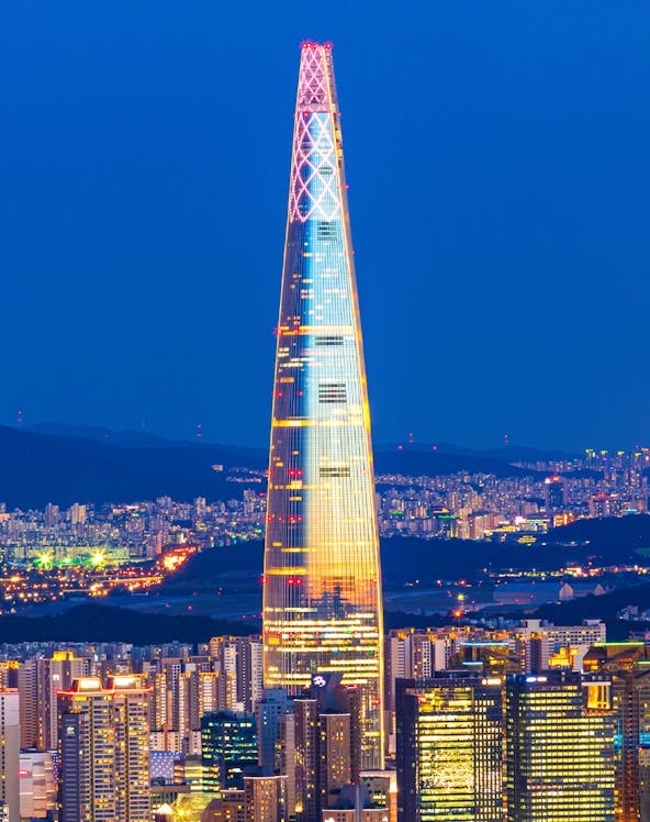 Lotte World Tower illuminated at night, view from Seoul Sky Observatory, South Korea.