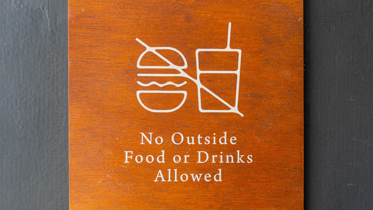 No outside food or drinks allowed sign at The TUBE Copenhagen.