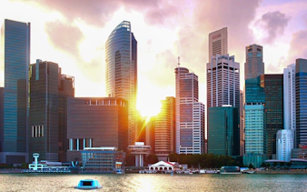 Singapore skyline viewed from a yacht at sunset.