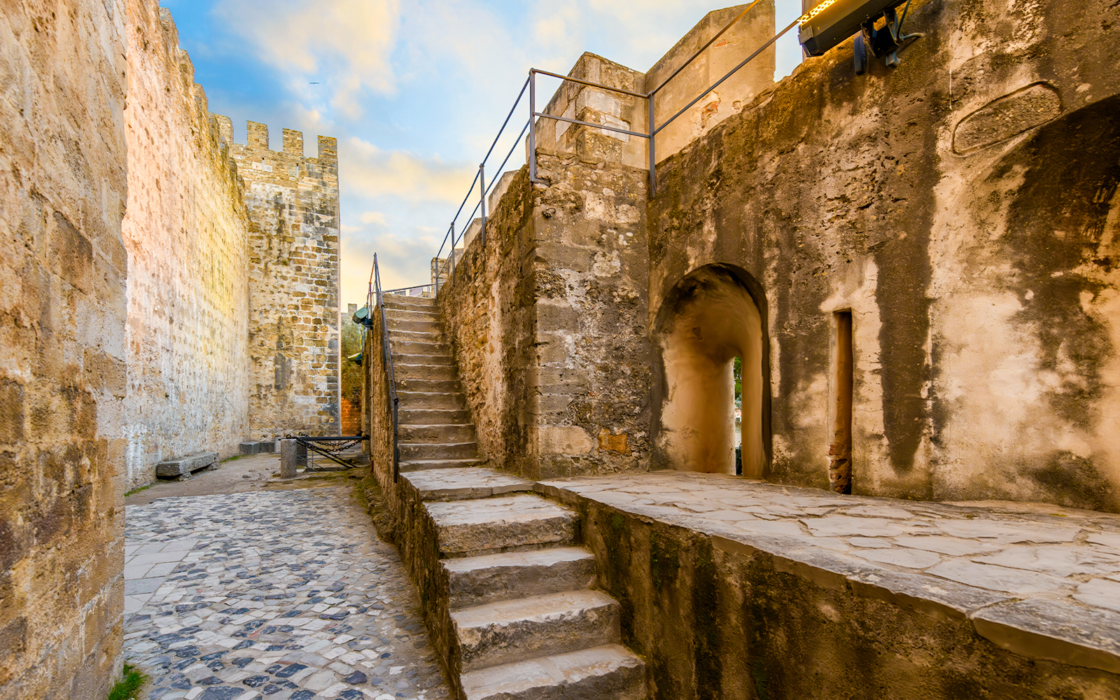 Stone pathway and stairs inside Sao Jorge Castle, Alfama district, Lisbon, Portugal.