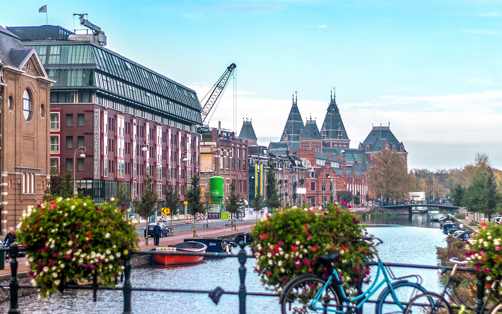 Canal view with historic buildings and bicycles in Amsterdam.