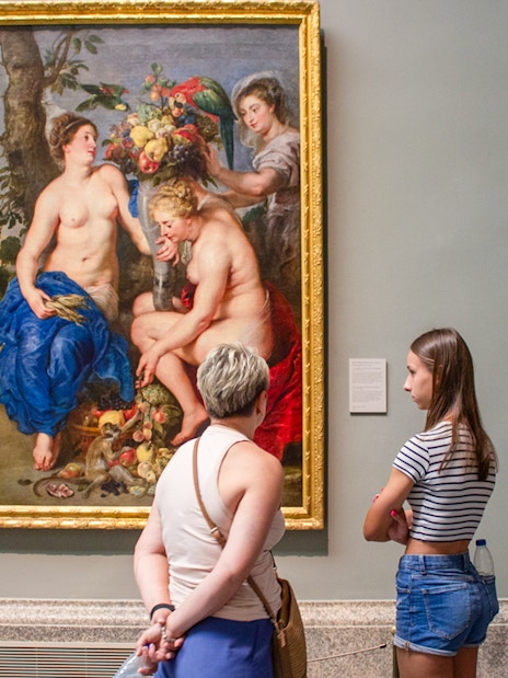 Visitors viewing a painting at Prado Museum, part of the "Skip The Line" Royal Palace + Prado Museum tour.