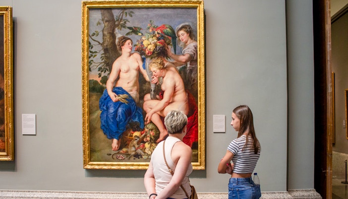 Tourists exploring the Royal Palace and Prado Museum with 'Skip The Line' access and transfer included in Madrid, Spain