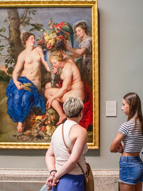 Visitors viewing a painting at Prado Museum, part of the "Skip The Line" Royal Palace + Prado Museum tour.