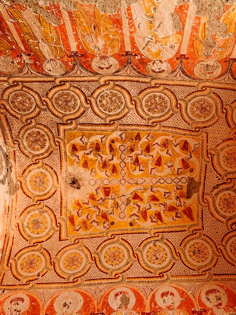 Old church ceiling decorations in Derinkuyu Underground City, featuring intricate patterns and faded frescoes.