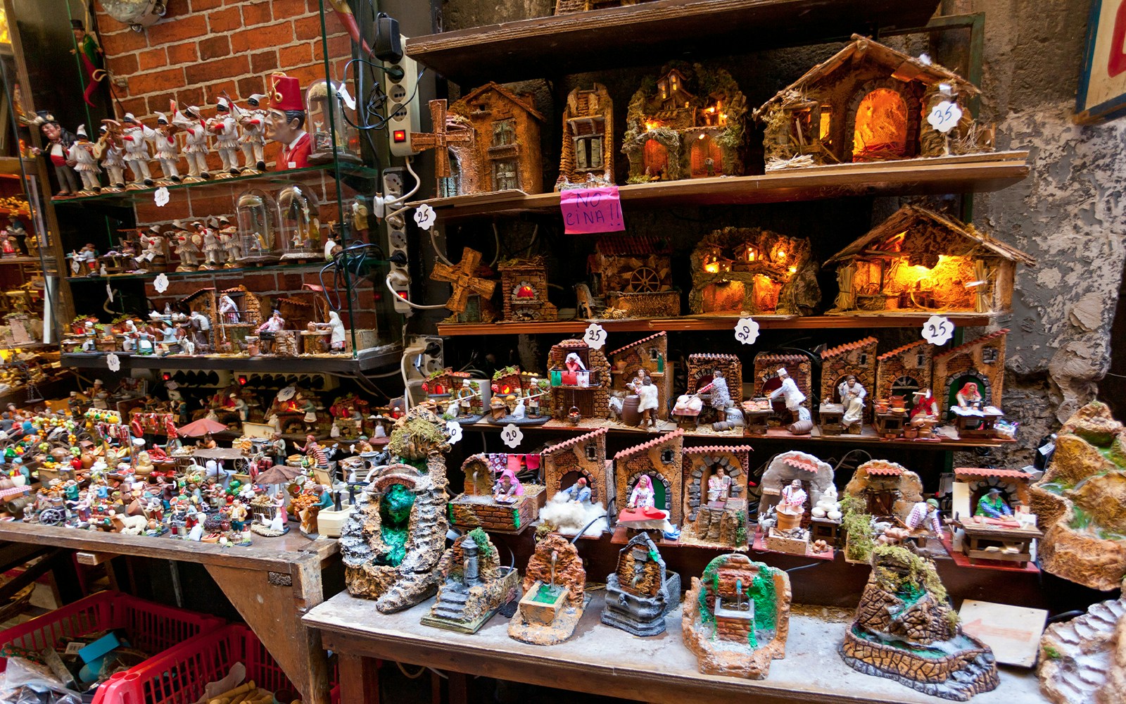 Spaccanapoli street view in Naples with bustling local shops and historic architecture.