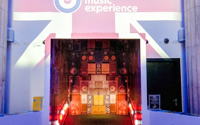 Entrance to the British Music Experience in Liverpool with speaker wall display.