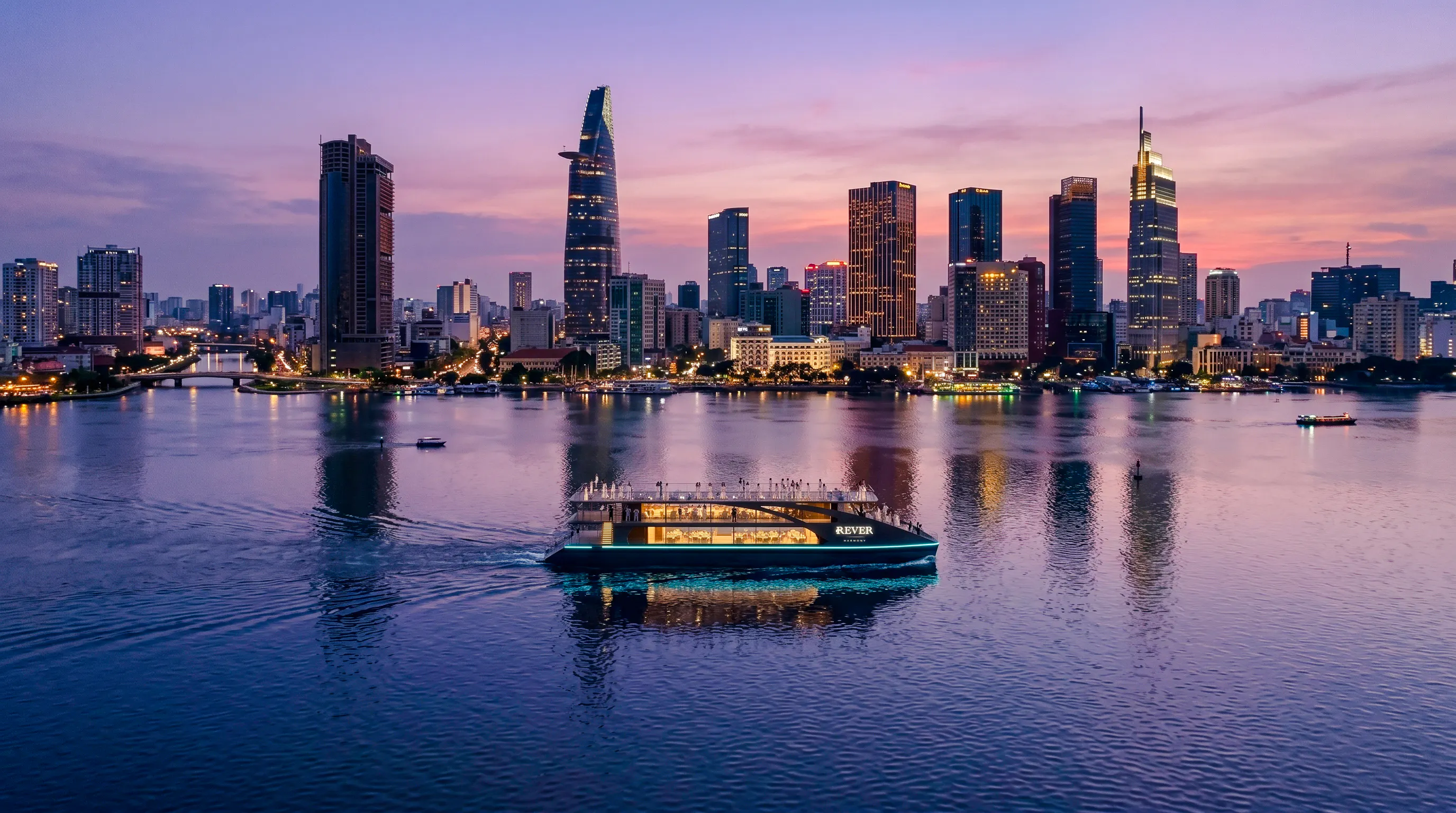 Cruise boat on Saigon River with Ho Chi Minh City skyline at sunset.