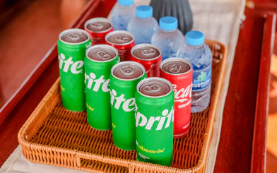 Soft drinks and water bottles in a basket on a tour boat.