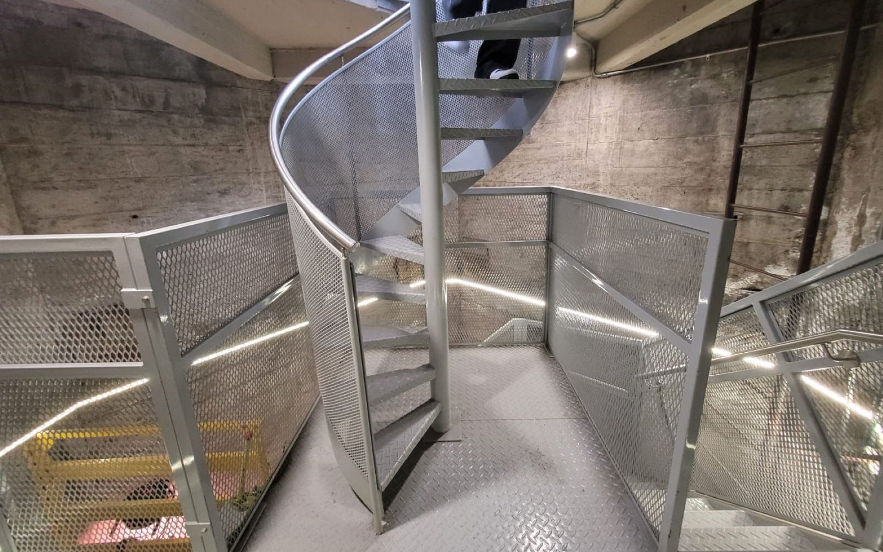 Interior spiral stairs of Obelisco de Buenos Aires, metal design and industrial setting.