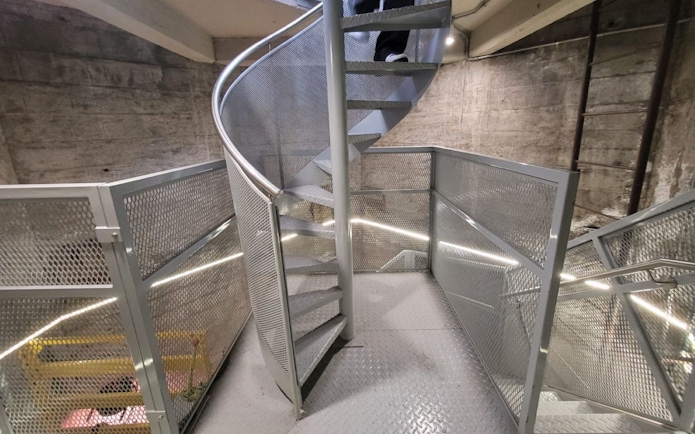 Interior spiral stairs of Obelisco de Buenos Aires, metal design and industrial setting.