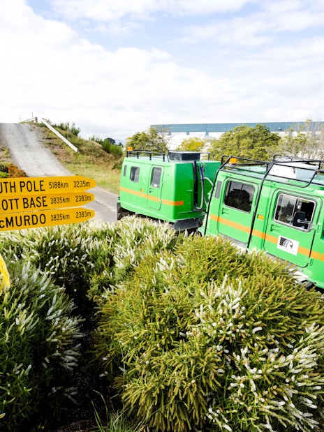 Hägglund vehicle on a track at the International Antarctic Centre, Christchurch, with directional signs.