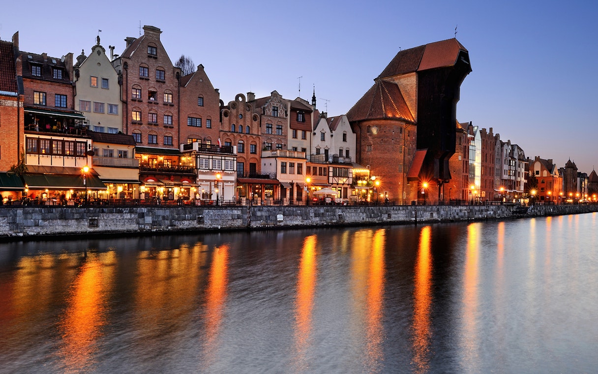 Old Town waterfront at sunset during Shipyard and Old Town Evening Cruise in Gdańsk, Poland.