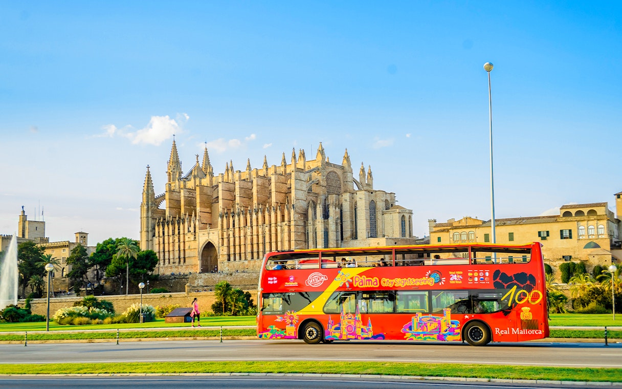 Hop-on hop-off bus near Palma Cathedral in Palma de Mallorca.