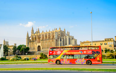 Hop-on hop-off bus near Palma Cathedral in Palma de Mallorca.