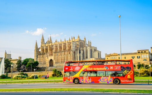 Hop-on hop-off bus near Palma Cathedral in Palma de Mallorca.