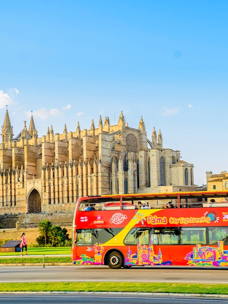 Hop-on hop-off bus near Palma Cathedral in Palma de Mallorca.