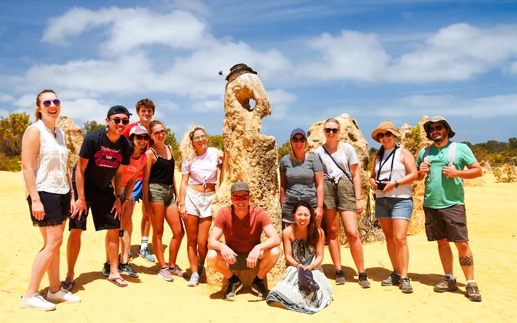 Tourists at Pinnacles Desert during sunset tour, Western Australia.
