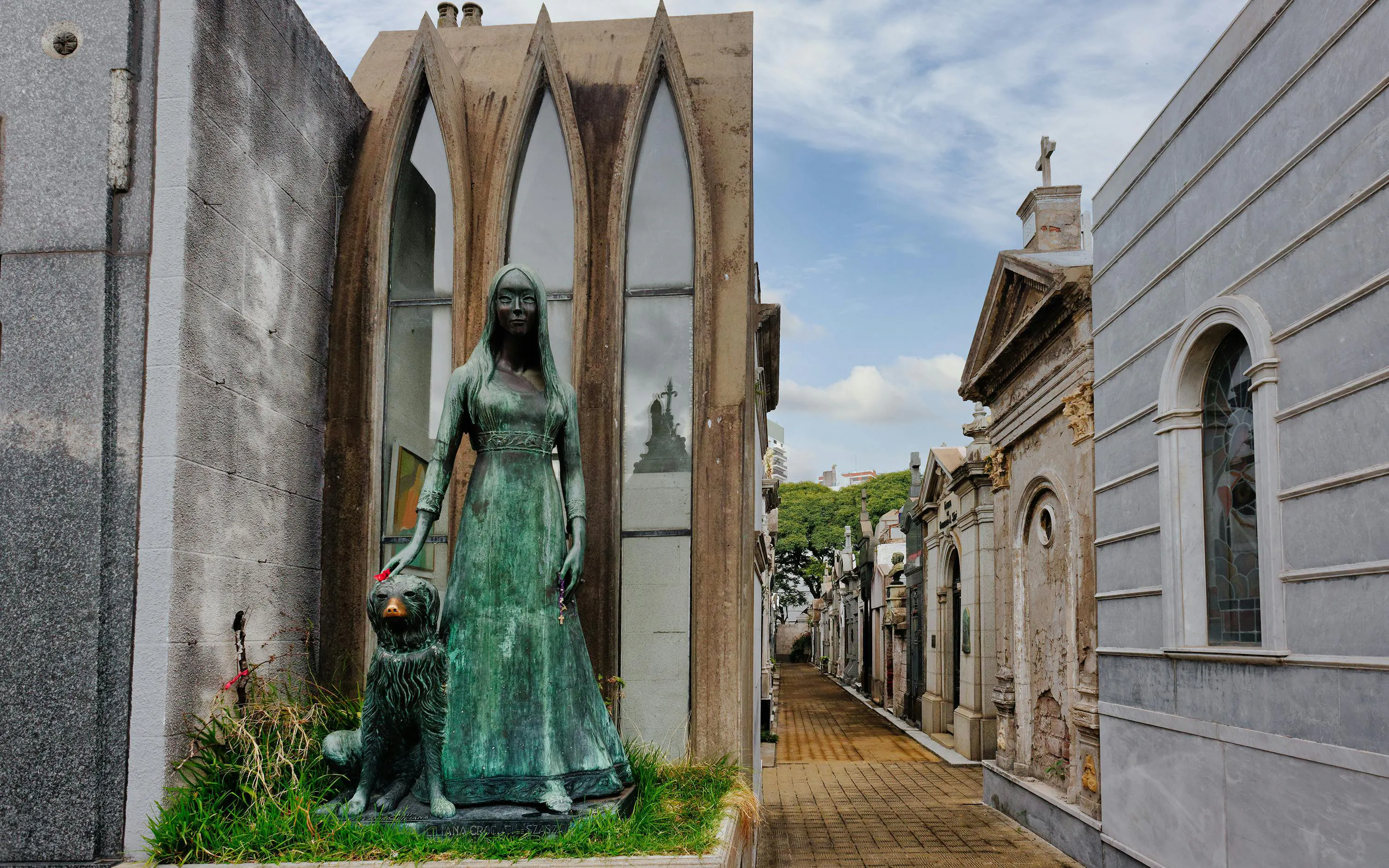 Statue of a woman and dog at La Recoleta Cemetery, Buenos Aires, Argentina.