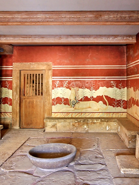 Knossos Palace frescoes and columns, Crete archaeological site.