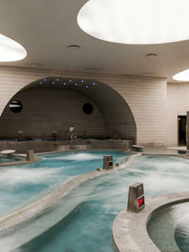 Indoor spa pools at Spa Land Centum City, Busan, featuring modern architecture and relaxation areas.