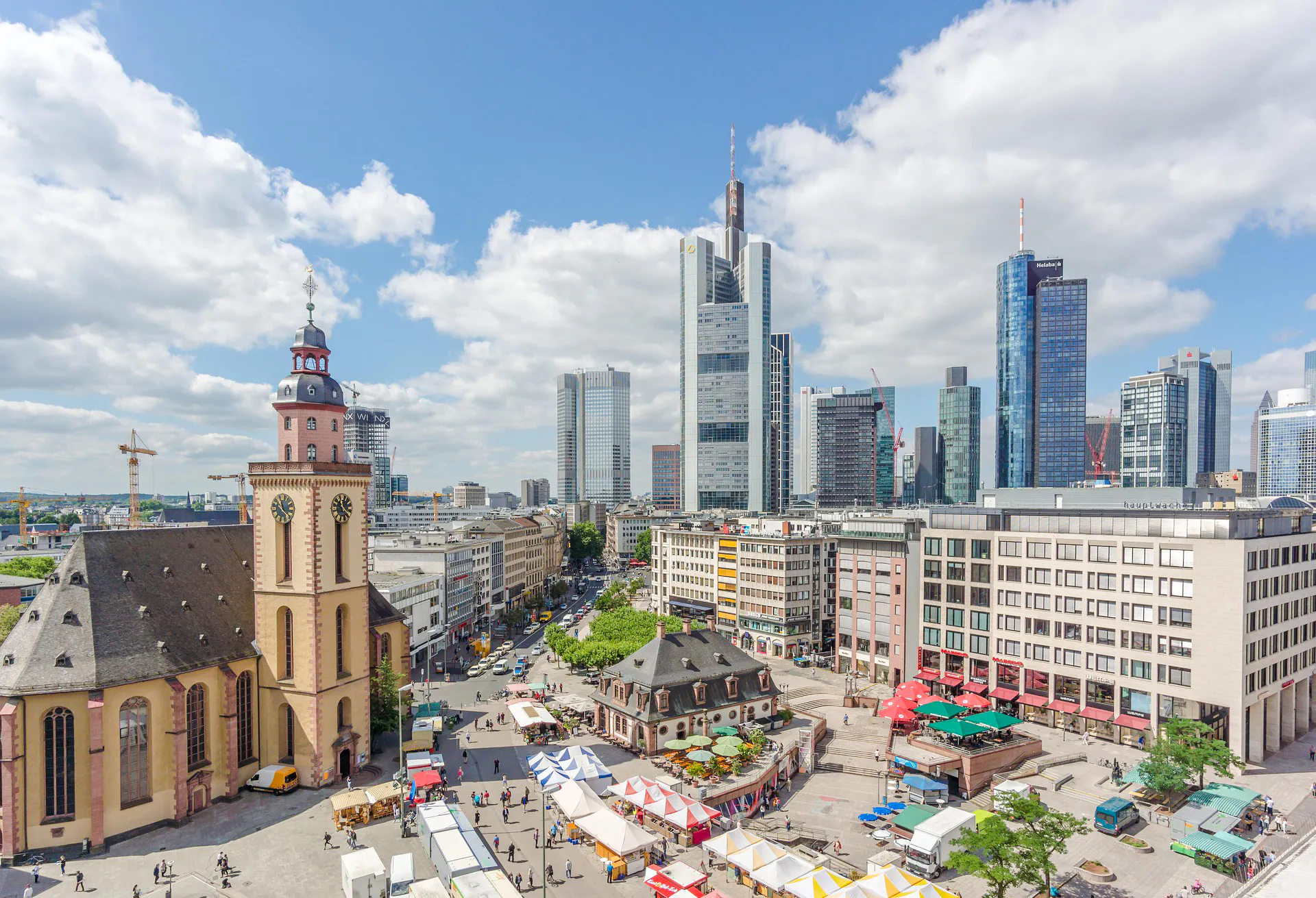 Frankfurt's Old Town with St. Catherine's Church and modern skyline in the background.