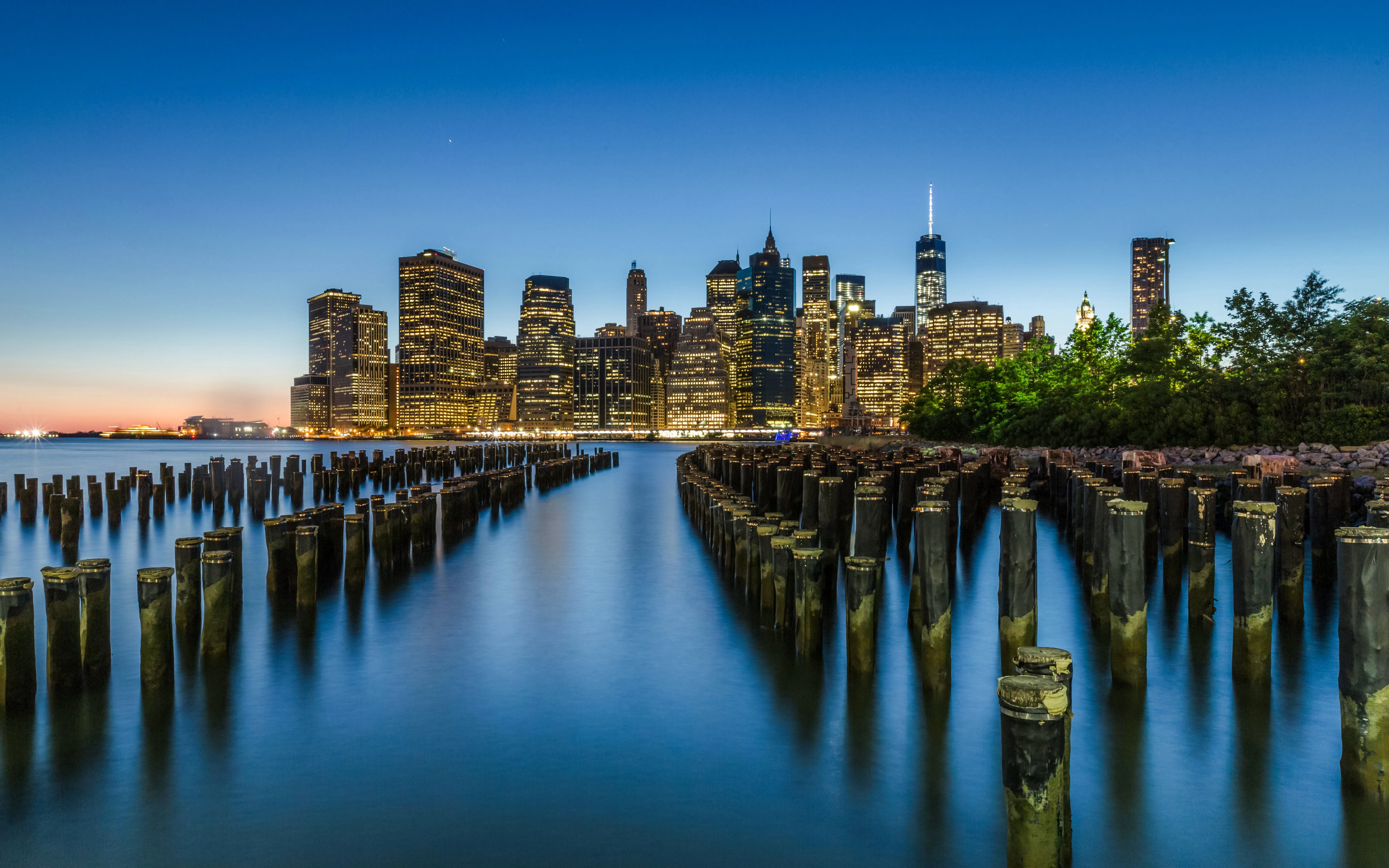Downtown Manhattan skyline viewed from old Brooklyn Pier 1 at dusk.