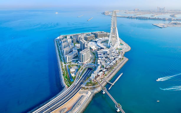 Aerial view of Bluewaters Island with Ain Dubai wheel and connecting road, Dubai.