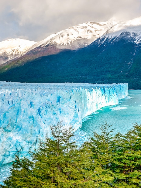 Perito Moreno Glacier with snow-capped mountains and turquoise lake in Patagonia, Argentina.