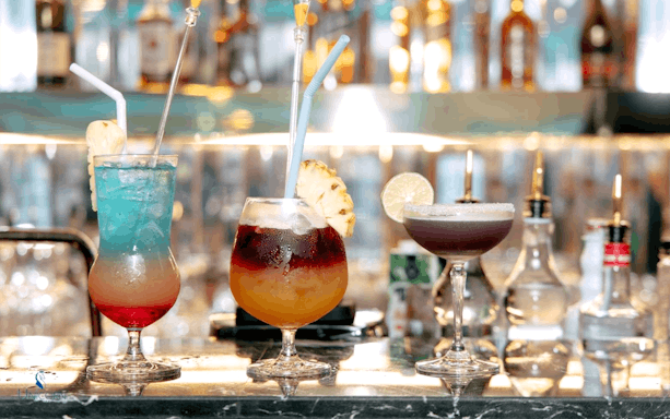 Colorful cocktails on a bar during the Unicorn Dinner Cruise in Bangkok.
