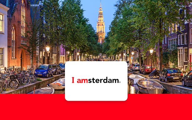 Amsterdam canal view with Westerkerk tower, promoting I amsterdam City Card.