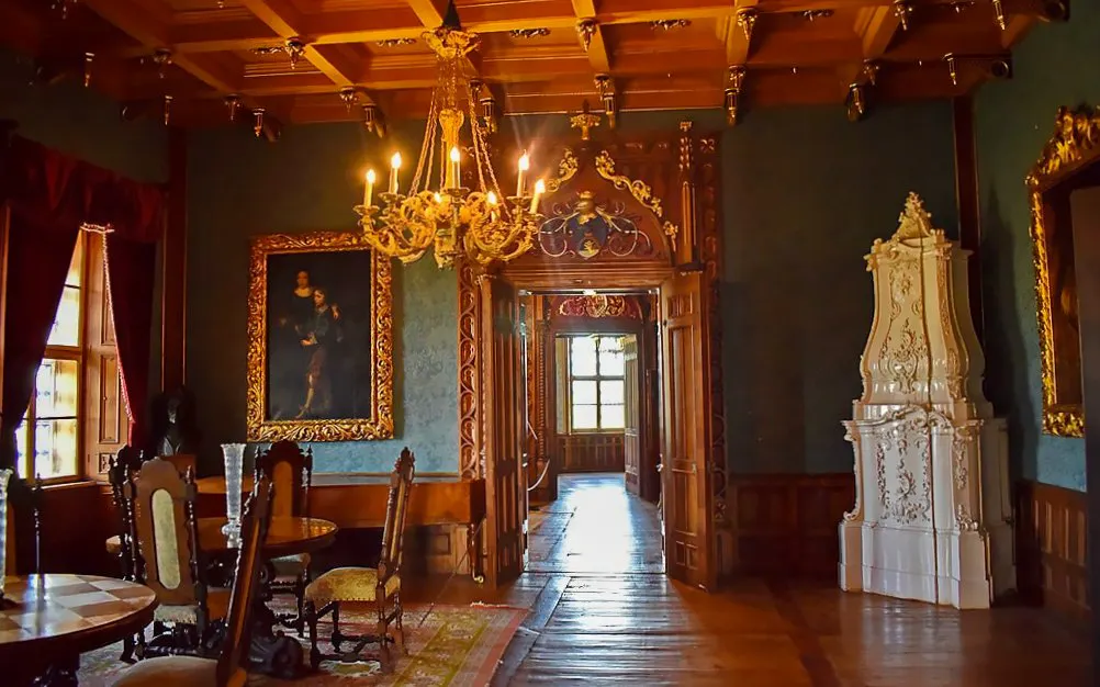 Interior of Trakošćan Castle in Croatia with ornate chandelier and historic furnishings.
