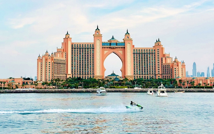 Tourist on jet ski near Atlantis, The Palm in Dubai.
