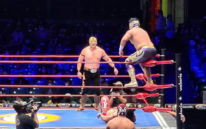 Wrestlers in a Lucha Libre match in Mexico City arena.