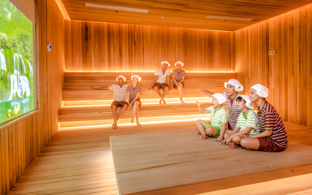 Family enjoying sauna at Aquafield Nha Trang, Vietnam's Korean-style wellness complex.