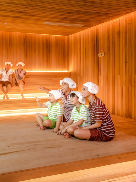 Family enjoying sauna at Aquafield Nha Trang, Vietnam's Korean-style wellness complex.