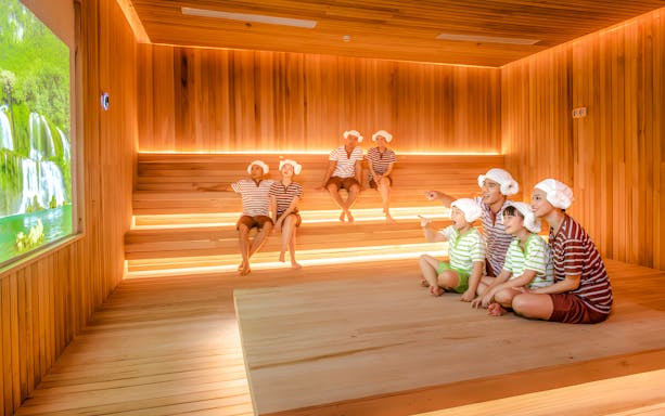 Family enjoying sauna at Aquafield Nha Trang, Vietnam's Korean-style wellness complex.