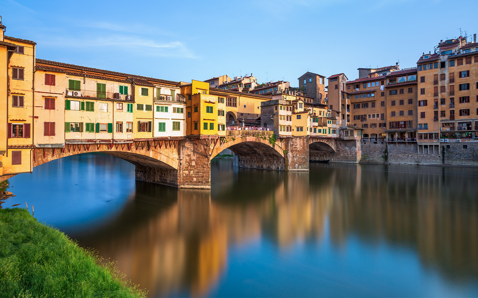 Ponte Vecchio over Arno River in Florence during walking tour.