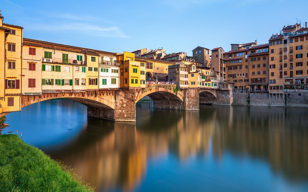 Ponte Vecchio over Arno River in Florence during walking tour.