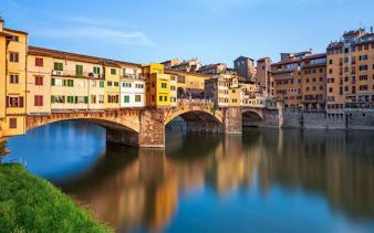 Ponte Vecchio over Arno River in Florence during walking tour.