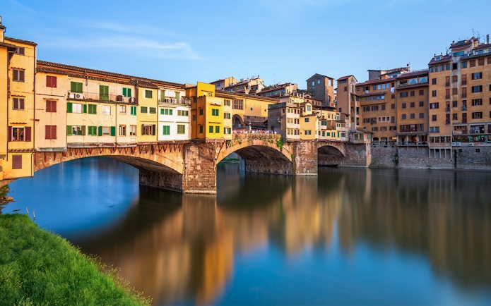 Ponte Vecchio over Arno River in Florence during walking tour.