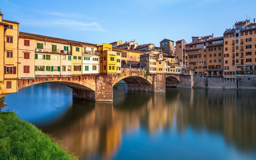 Ponte Vecchio over Arno River in Florence during walking tour.