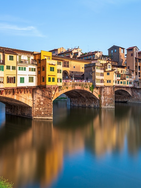 Ponte Vecchio over Arno River in Florence during walking tour.